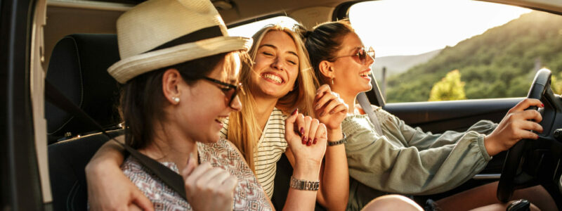 Three best female friends travel together.They drives a car and making fun.Summer adventure..